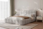 Seitenansicht des eleganten Bettes Bubble (200x200 cm) im Bouclé-Stoff, harmonisch integriert in ein gemütliches Schlafzimmer-Arrangement. im abriamo_05