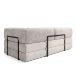 Rückseitige Perspektive des Sofas EDI, die den schwarzen Metallrahmen und die durchgehende Cord-Polsterung auf dem Rücken hervorhebt.