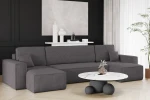 Modernes Interieur mit der dunkelgrauen Wohnlandschaft KARL U im kuscheligen Poso 22 Cord-Gewebe auf einem Holzfußboden.