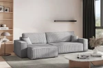 Modernes Wohnkonzept mit dem lichtgrauen Lounge-Sofa KARL XL im strapazierfähigen Cordstoff Poso 110 vor einem hellen Fenster.