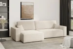 Cremefarbenes Ecksofa KARL XL im weichen Bouclé-Stoff Quelle 02, stilvoll arrangiert in einem modernen Wohnzimmer mit schwarzem Regal.