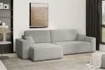 Zeitloses Raumdesign mit dem hellgrauen L-Form Sofa KARL XL im flauschigen Bouclé-Gewebe Quelle 83 neben einem Beistelltisch.