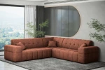 Warmes Raumambiente mit der terrakottafarbenen Wohnlandschaft Balia Corner im samtigen Chenille Perfect Harmony 52 auf einem dunklen Teppich.