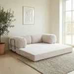 Das vollständig ausgeklappte Schlafsofa MUNO im Poso Cord Design bietet eine 200x100 cm große und bequeme Liegefläche.
