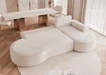 Detailansicht der bequemen Kissen und der Rückenlehne des 277x157 cm großen Sofas Sofia XL im luxuriösen Design aus Abriamo Boucle und Riviera Velour.