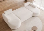 Seitenansicht des Sofas Sofia U, die die Tiefe der 316x157 cm großen Fläche sowie die luxuriöse Qualität von Riviera Velour und Abriamo Boucle hervorhebt.