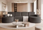 Eine stilvolle Raumsituation mit dem Ecksofa Sofia U (316x157 cm), dessen eleganter Materialmix aus Abriamo Boucle und Riviera Velour hier optimal zur Geltung kommt.