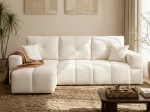 Frontalansicht des Ecksofas BUENO L (250x148 cm) mit weichem Bouclé-Bezug, stilvoll arrangiert in einem modernen Wohnzimmer.