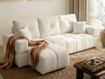 Frontalansicht des Ecksofas BUENO L (250x148 cm) mit weichem Bouclé-Bezug, stilvoll arrangiert in einem modernen Wohnzimmer.