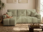 Frontalansicht des Ecksofas BUENO L (250x148 cm) mit weichem Bouclé-Bezug, stilvoll arrangiert in einem modernen Wohnzimmer.