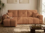 Frontalansicht des Ecksofas BUENO L (250x148 cm) mit weichem Bouclé-Bezug, stilvoll arrangiert in einem modernen Wohnzimmer.