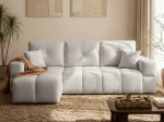 Frontalansicht des Ecksofas BUENO L (250x148 cm) mit weichem Bouclé-Bezug, stilvoll arrangiert in einem modernen Wohnzimmer.