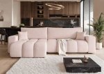 Frontalansicht des Design Ecksofas OFI XL (278x145 cm) mit weichem Bouclé-Bezug, stilvoll arrangiert in einem modernen Wohnzimmer.