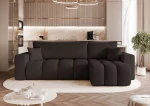 Frontalansicht des Design Ecksofas L-Form OFI L (248x145 cm) mit weichem Bouclé-Bezug, stilvoll arrangiert in einem modernen Wohnzimmer.