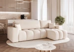 Schräge Ansicht des Design Ecksofas L-Form OFI L (248x145 cm) mit weichem Bouclé-Bezug, stilvoll arrangiert und integriert in eine moderne Wohnumgebung.