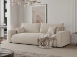 Schräge Ansicht des Design Sofas PIANO (246x93 cm) mit weichem Cord und Bouclé Bezug, stilvoll arrangiert und integriert in eine moderne Wohnumgebung.