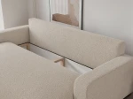 Das ausgeklappte Schlafsofa PIANO (246x93 cm) aus Cord und Bouclé Stoff mit geöffnetem, integriertem Bettkasten für zusätzlichen Stauraum.