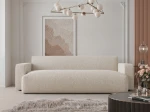 Frontalansicht des Design Sofas PIANO (246x93 cm) mit weichem Cord und Bouclé Bezug, stilvoll arrangiert in einem modernen Wohnzimmer.