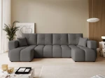 Frontalansicht der Design U-Form Wohnlandschaft BUENO U (318x145 cm) mit weichem Bouclé-Bezug, stilvoll arrangiert in einem modernen
