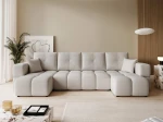 Frontalansicht der Design U-Form Wohnlandschaft BUENO U (318x145 cm) mit weichem Bouclé-Bezug, stilvoll arrangiert in einem modernen