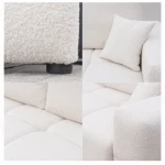 Nahaufnahme der Polsterung des Sofas BUENO (239x91 cm), welche die feine und gemütliche Textur des hochwertigen Bouclé-Stoffes präsentiert.