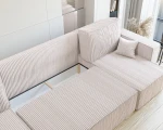 Das ausgeklappte Schlafsofa der Wohnlandschaft PARIS U (312x145 cm) aus Poso Cordstoff mit geöffnetem, integriertem Bettkasten für zusätzlichen Stauraum.