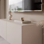 Nahaufnahme der grifflosen Fronten des Hänge-TV-Boards ANGEL 100, welche das praktische Push-To-Open-System und das elegante Design präsentiert.