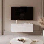 Frontalansicht des Hänge-TV-Boards ANGEL 100 mit stimmungsvoller LED-Beleuchtung, stilvoll arrangiert in einem modernen Wohnzimmer.