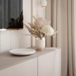 Nahaufnahme der grifflosen Fronten des Hänge-TV-Boards ANGEL 200, welche das praktische Push-To-Open-System und das elegante Design präsentiert.