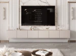 Frontalansicht des Hänge-TV-Boards ANGEL 300 mit stimmungsvoller LED-Beleuchtung, stilvoll arrangiert in einem modernen Wohnzimmer.