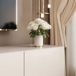 Nahaufnahme der grifflosen Fronten des TV-Boards ANGEL 100, welche das praktische Push-To-Open-System und das elegante Design präsentiert.