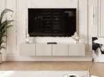 Frontalansicht des hängenden TV-Lowboards ANGEL (200 cm) mit stilvollen geriffelten Fronten und stimmungsvoller LED-Beleuchtung, arrangiert in einem modernen Wohnzimmer.