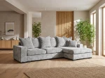 Frontalansicht des modernen Ecksofas SELLO L mit weichem Bezug aus Flow (Chenille), stilvoll arrangiert in einem modernen Wohnzimmer.