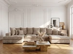 Frontalansicht der großen Wohnlandschaft SELLO in U-Form mit weichem Bezug aus Flow (Chenille), stilvoll arrangiert in einem geräumigen Wohnzimmer.