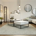 Frontalansicht des modernen Couchtisch-Sets ELEGANT 2in1 mit integrierter Schublade, stilvoll arrangiert in einem gemütlichen Wohnzimmer.
