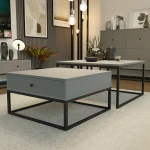 Nahaufnahme des Couchtisch-Sets ELEGANT, welche die hochwertige Verarbeitung der Tischplatten und das stilvolle Design der Frontschublade im Detail präsentiert.