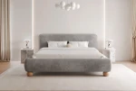 Frontalansicht des modernen Polsterbettes OVELIO SLIM (200x200 cm) mit platzsparendem Design und weichem Kopfteil, stilvoll arrangiert in einem gemütlichen Schlafzimmer.
