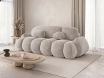 Schräge Seitenansicht des modernen Sofas STONE mit Bezug aus Vibe 08.