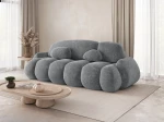 Schräge Seitenansicht des modernen Sofas STONE mit Bezug aus Vibe 95.