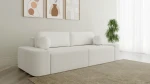 Schräge Ansicht des Sofas OVAL im Farbton Anthology 1, stilvoll arrangiert und harmonisch integriert in eine moderne Wohnumgebung.
