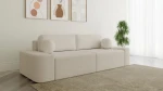 Schräge Ansicht des Sofas OVAL im Farbton Arena 20, stilvoll arrangiert und harmonisch integriert in eine moderne Wohnumgebung.