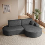 Das elegante Ecksofa Prima Pro im dunkelgrauen Cordstoff Poso 34, perfekt in Szene gesetzt in einer gemütlichen Wohnumgebung.
