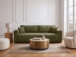 Das komfortable Schlafsofa Capri im olivgrünen Cordstoff Poso 46, harmonisch abgestimmt auf eine helle und natürliche Wohnzimmereinrichtung.